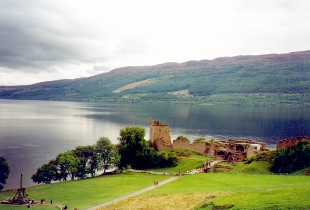 photograph of Urquhart Castle near Inverness, Scotland, with a siege engine being tested